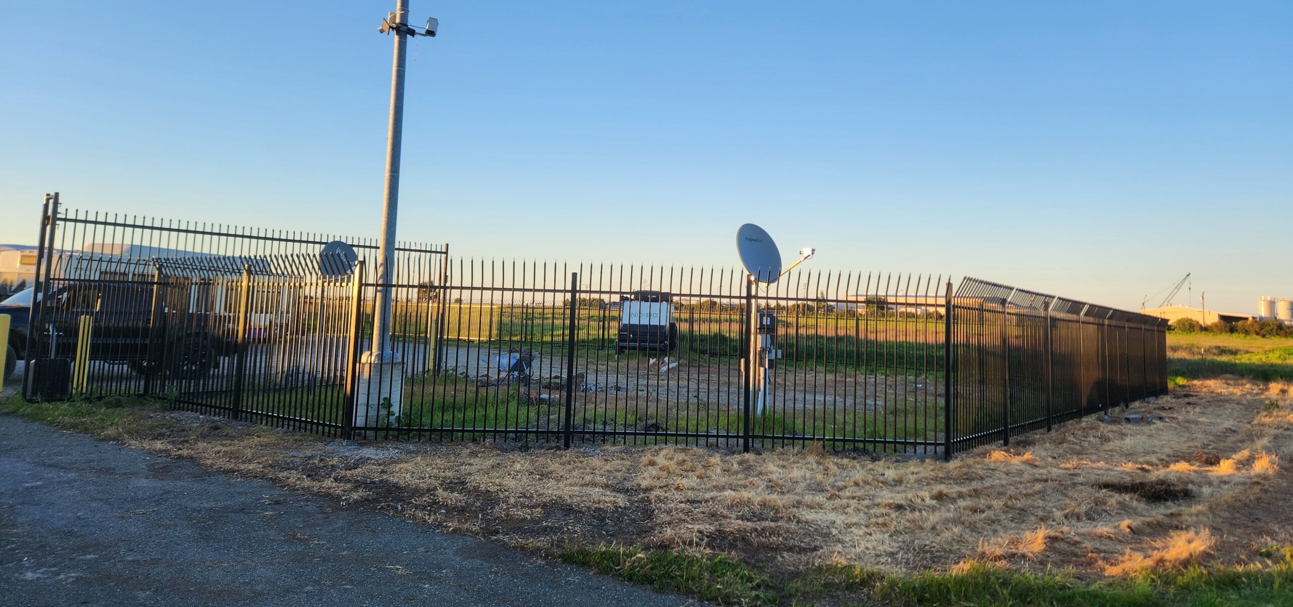 Completed commercial ornamental iron fence by Palmer Fence