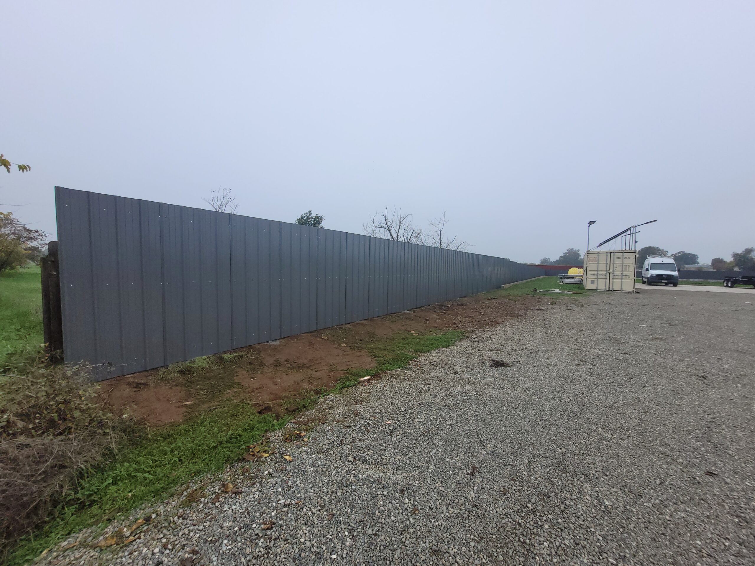 Finished charcoal corrugated metal privacy fence, Elverta