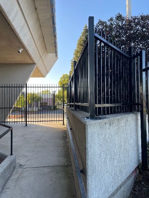 Ornamental iron posts plated to a concrete retaining wall at the Univision station, Sacramento