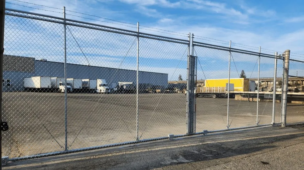 Galvanized commercial chain link perimeter around a trucking yard in the Sacramento area, built by Palmer Fence