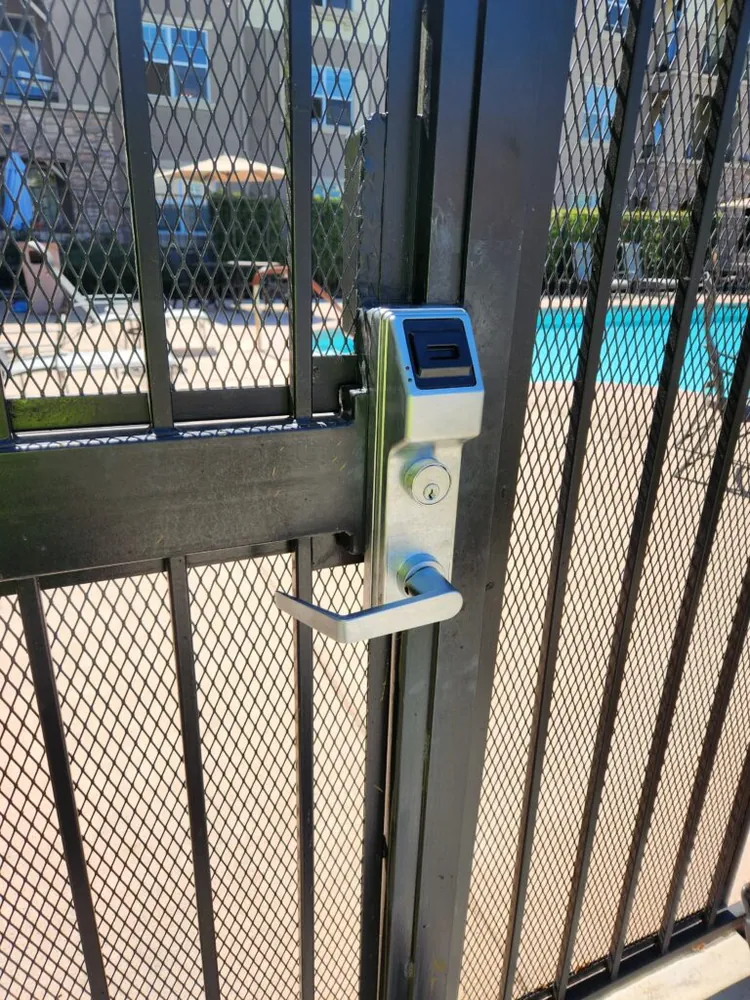 Access control keypad and latch on a commercial pedestrian gate installed by Palmer Fence