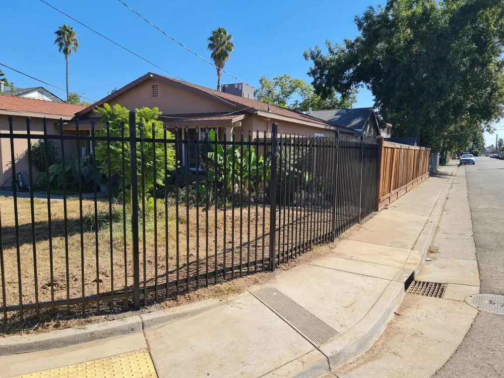 Black spear-top ornamental iron fence installed by Palmer Fence at a Sacramento property