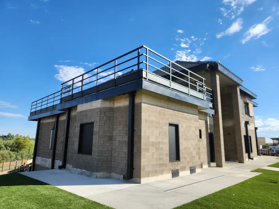 Galvanized steel guardrail posts anchored to the concrete roof at the El Dorado Hills Fire Department