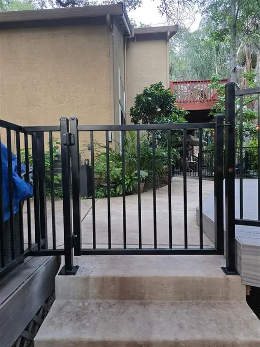 Ornamental iron man gate built by Palmer Fence in Folsom