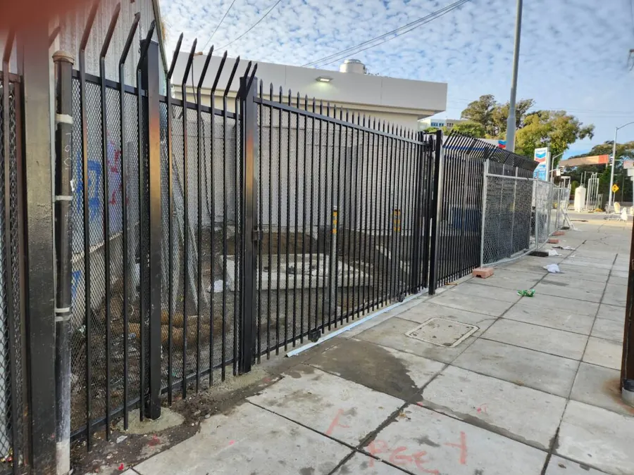 8-foot anti-climb ornamental iron security fence with expanded metal infill in San Francisco by Palmer Fence