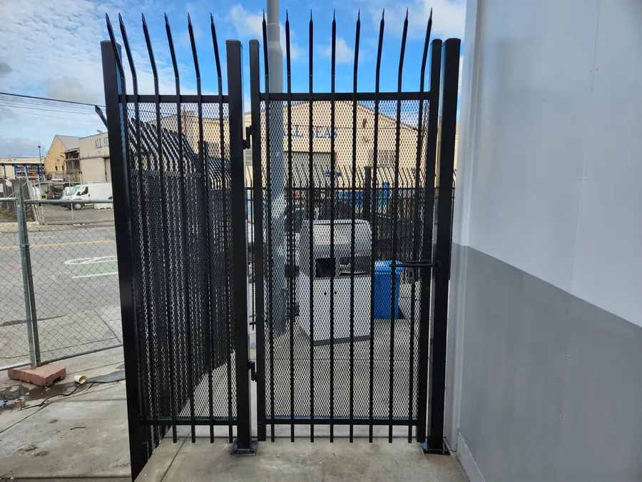 4-foot ornamental iron walk gate with expanded metal sheet and curved spear top, San Francisco